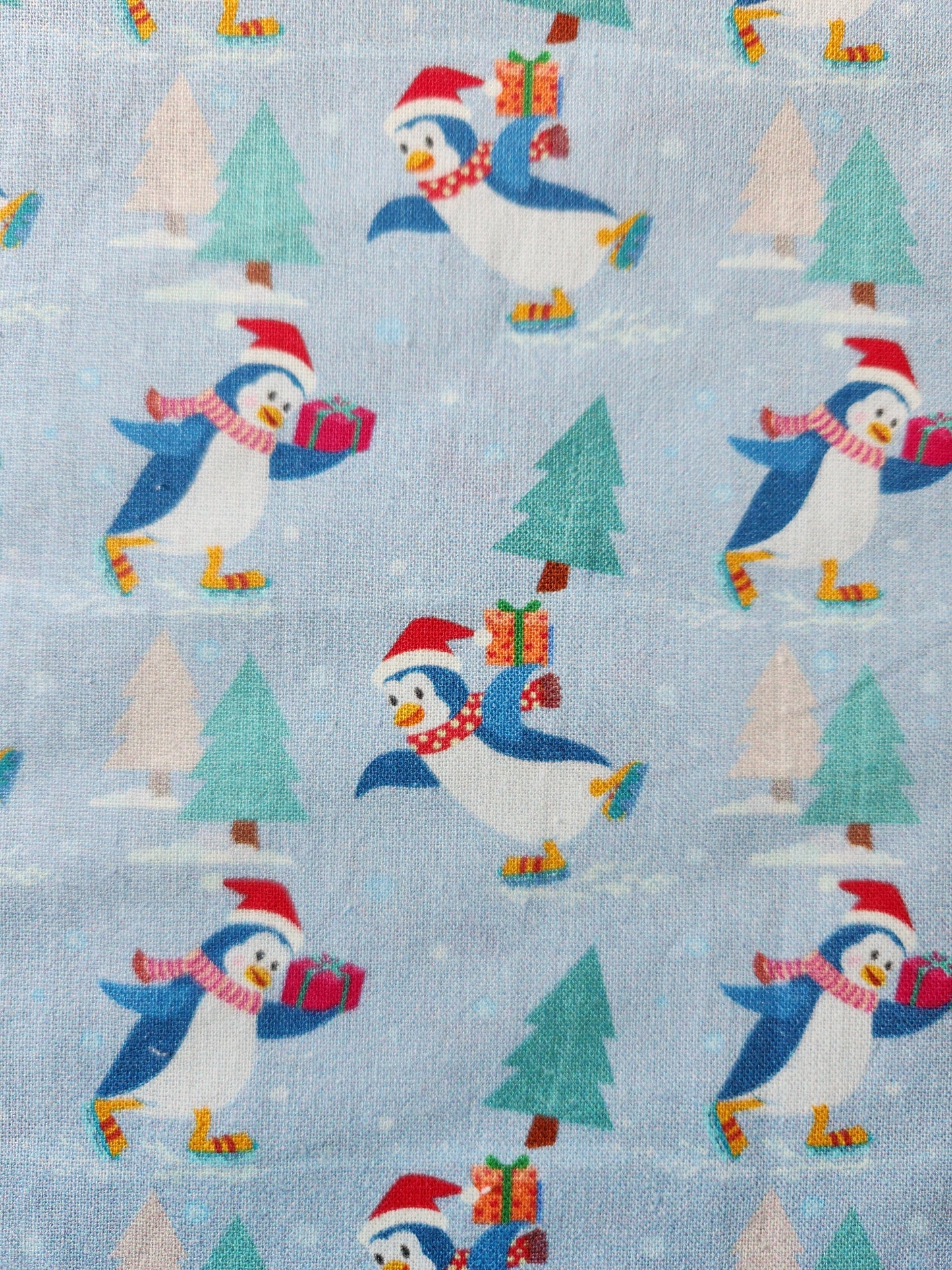 Christmas fabric - blue background with cute penguins