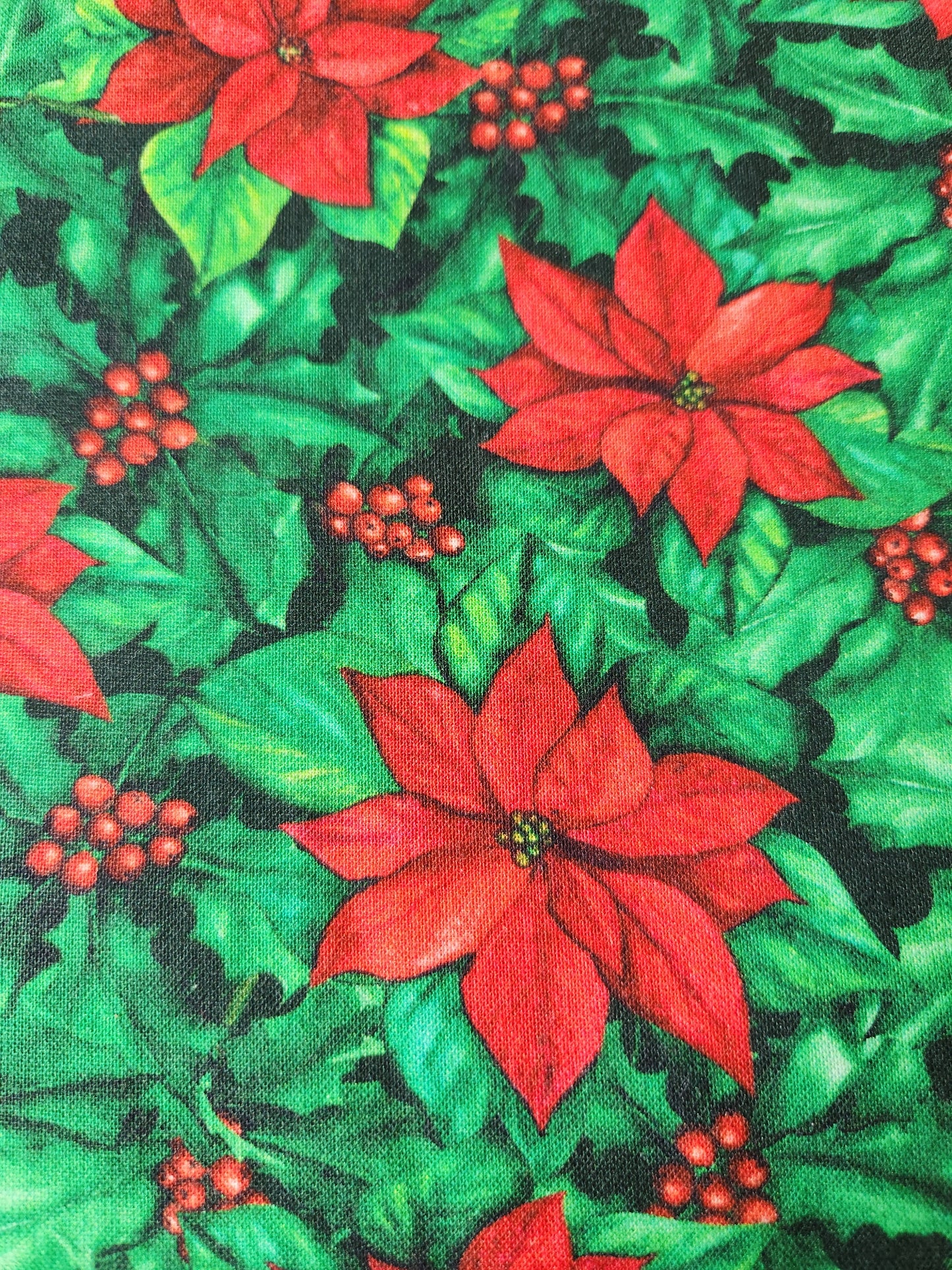 Christmas fabric - green background with red poinsettia