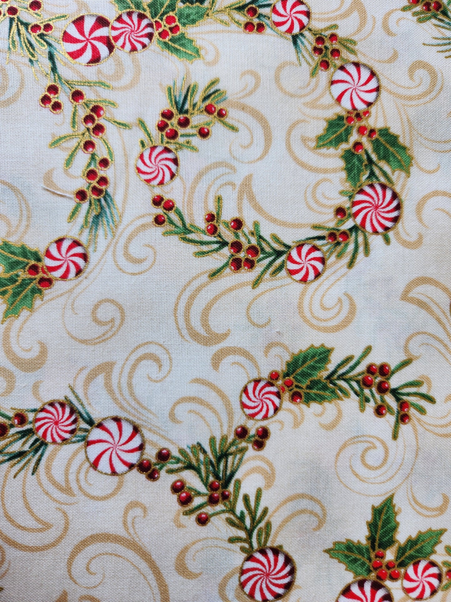 Christmas fabric.  Cream background with peppermint candy twist and holly berries