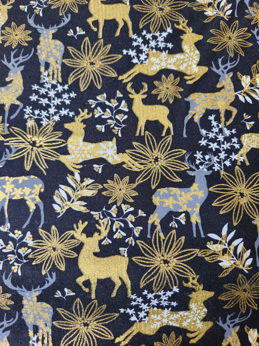 Christmas fabric - black background with white and gold reindeer and floral accents