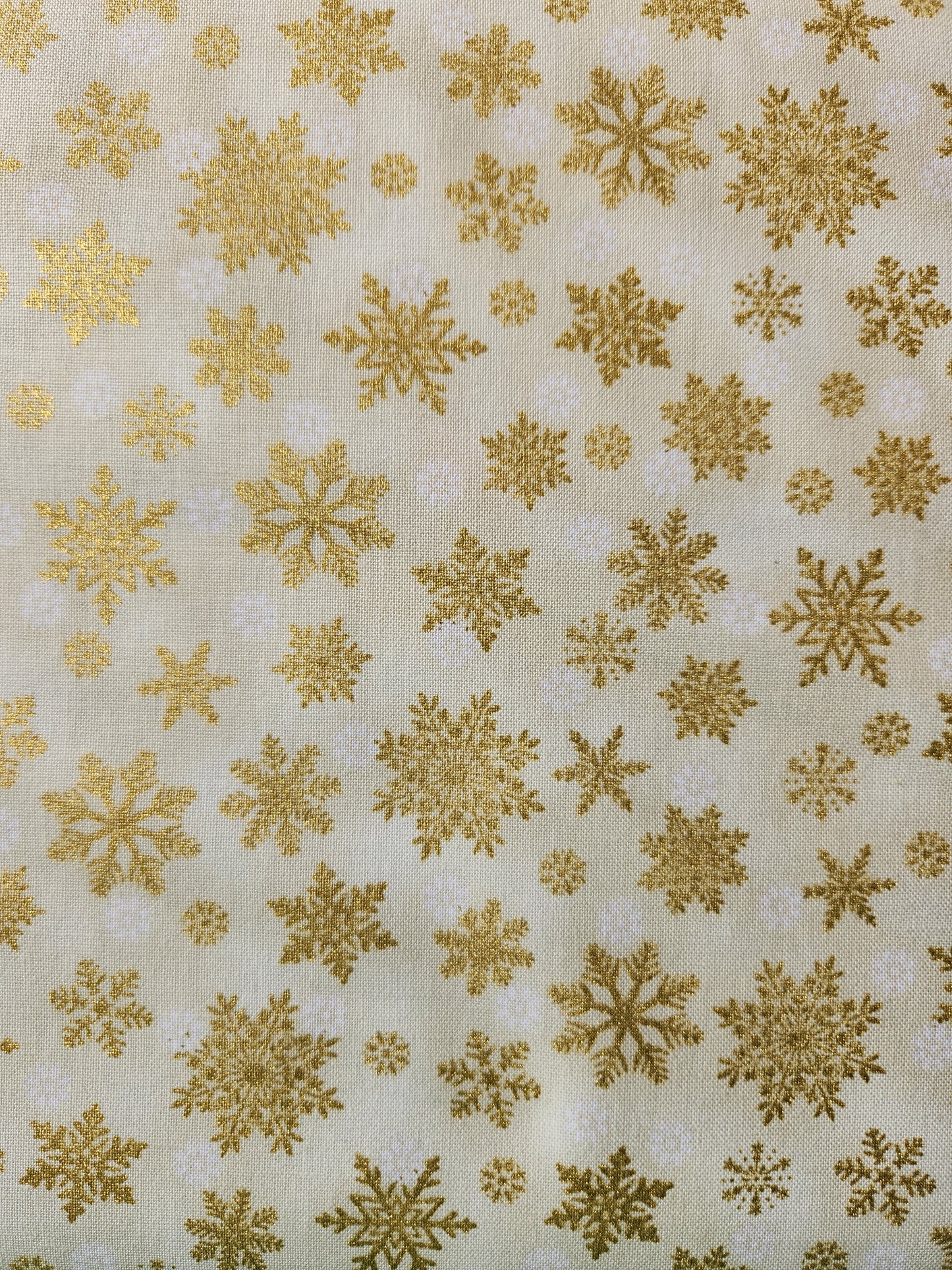 Christmas fabric - cream background with gold tossed snowflakes