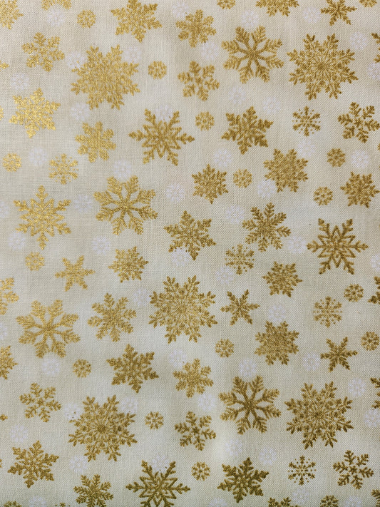 Christmas fabric - cream background with gold tossed snowflakes